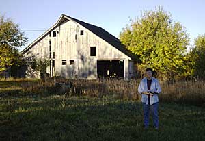Diane Wright and the barn that features in one of her drawings.